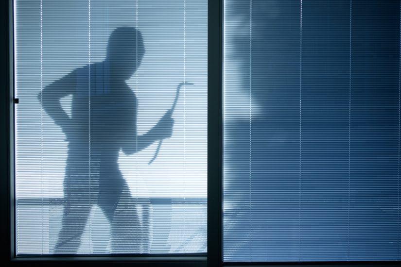 A thief is going to to robbery breaking into someone's house